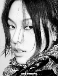 Behind the screen, she rises