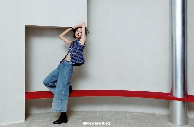 Behind the screen, she rises