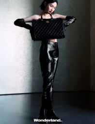 Behind the screen, she rises